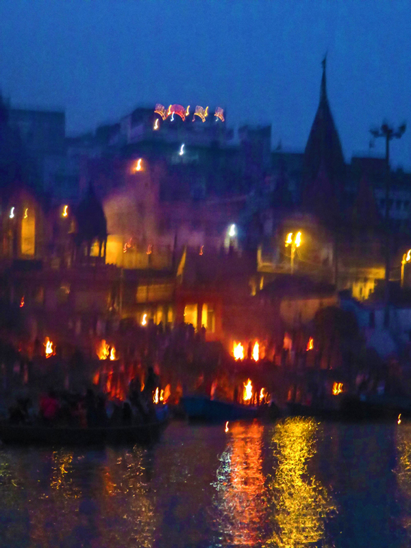 Photograph of the funeral pyres on the Ganges River in Varanasi